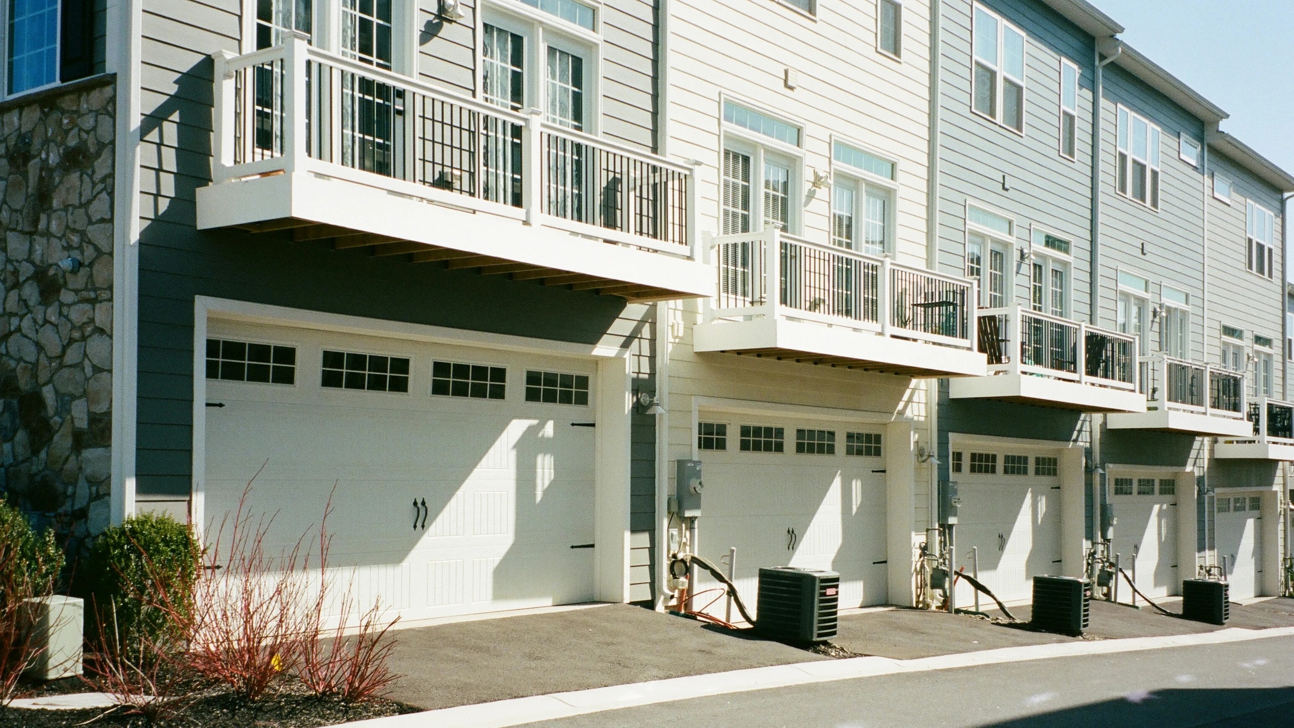 A row of townhomes with garages